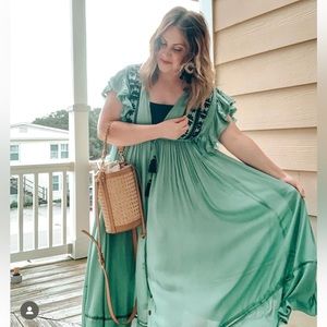 Free People dress - worn a few times. Turquoise/teal color with black details.